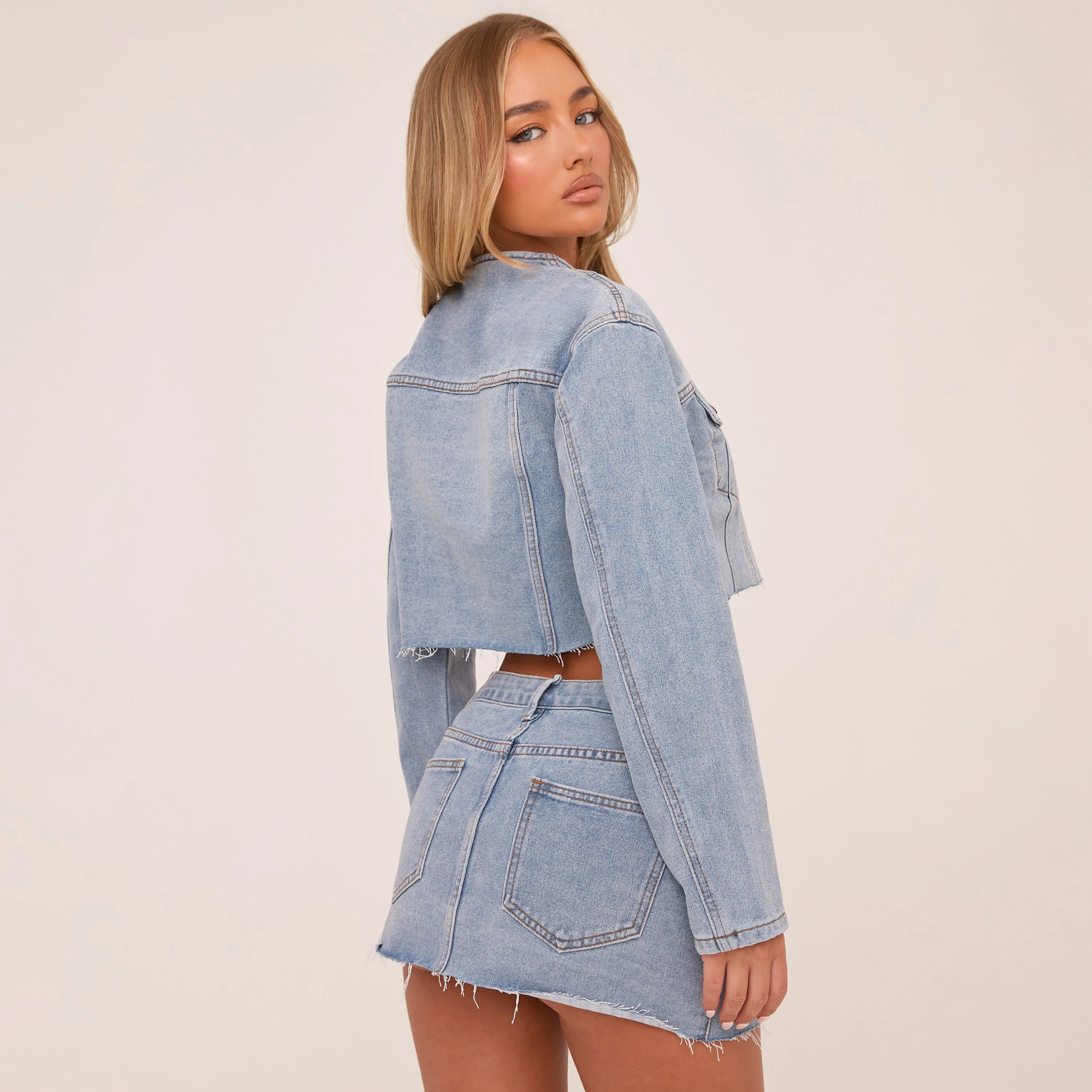 Mid Rise Button Up Mini Skirt In Light Blue Denim