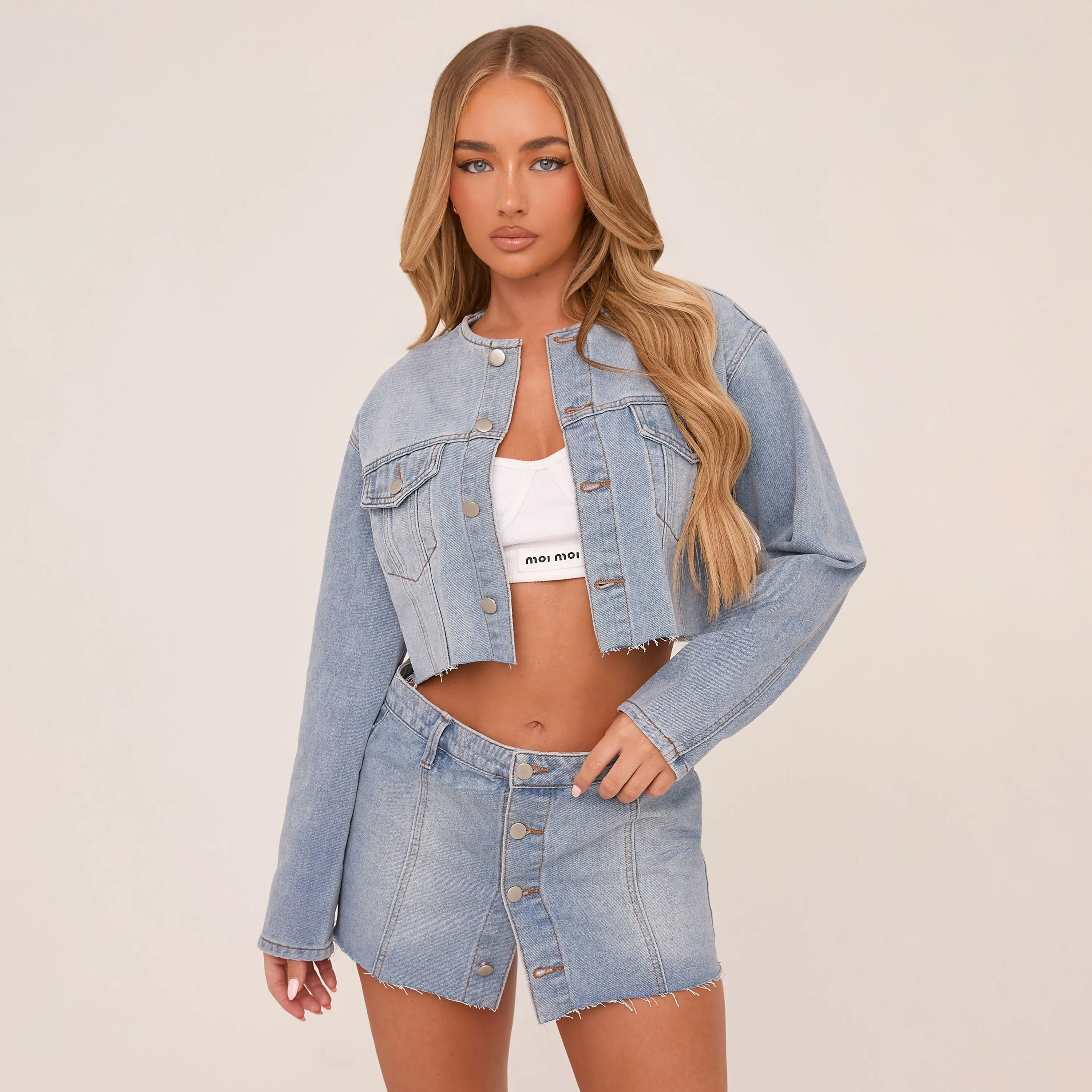 Mid Rise Button Up Mini Skirt In Light Blue Denim